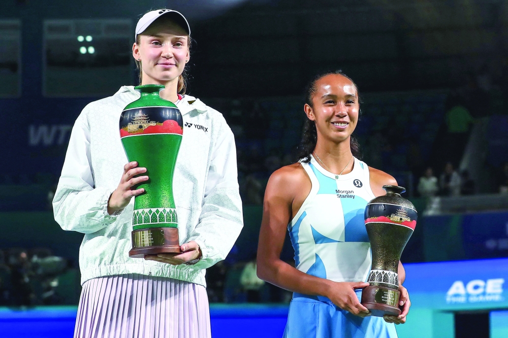 Winner Kazakhstan's Elena Rybakina and runner up Canada's Leylah Fernandez pose for a picture with their trophy after their women's singles final match at the Ningbo Open tennis tournament in Ningbo. — AFP