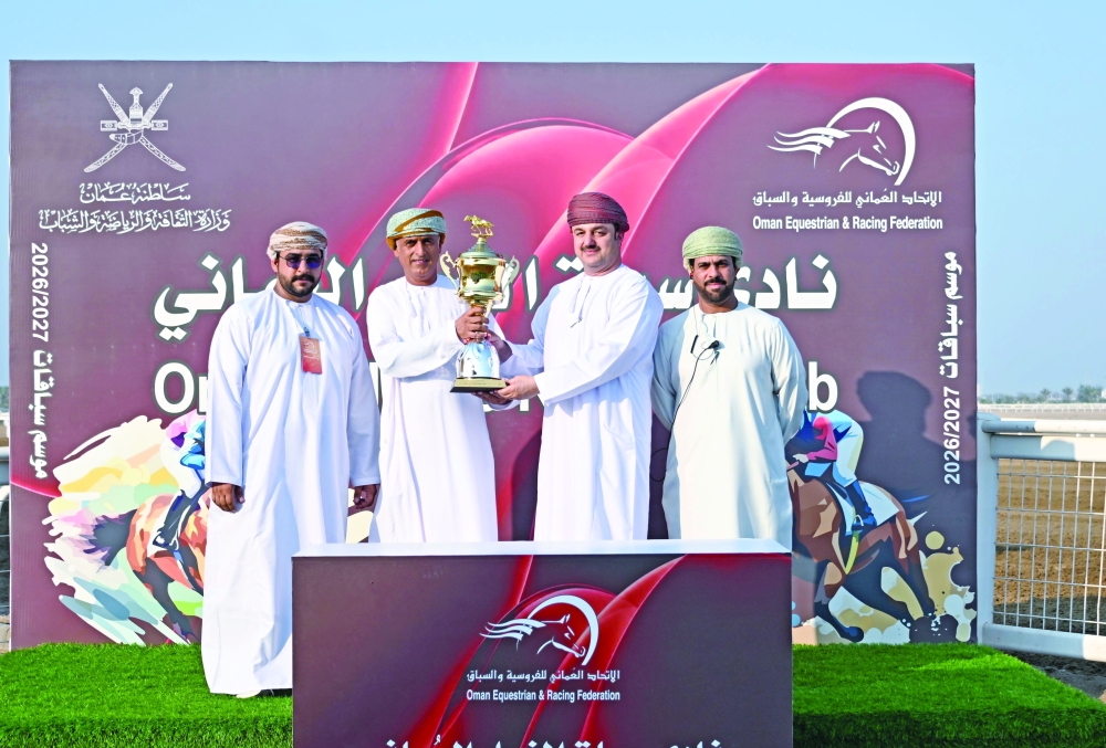 Owner Mohammed bin Yousef al Balushi receives the winner’s trophy.
