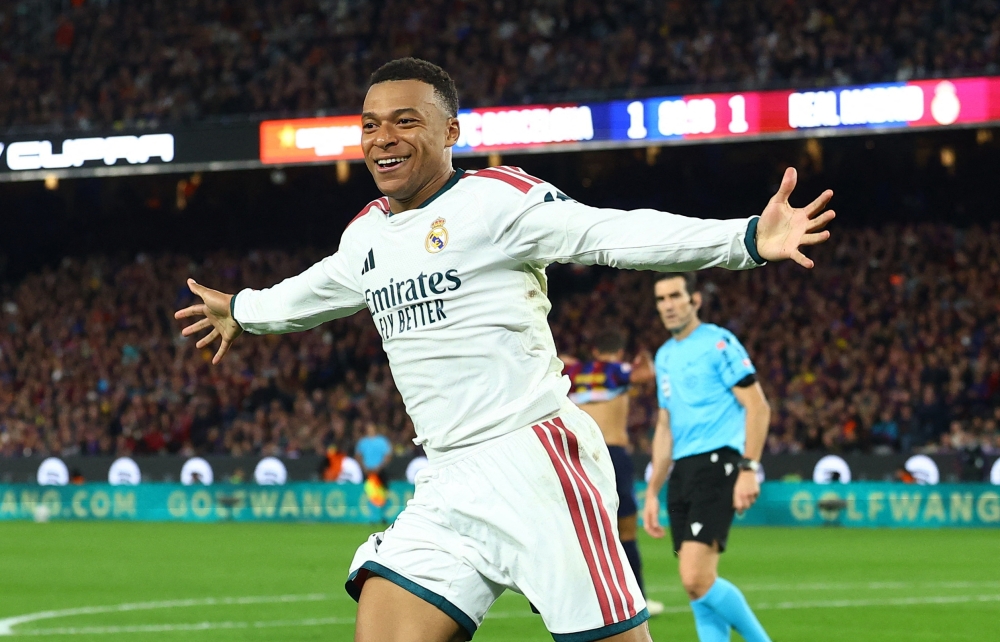  
Real Madrid's Kylian Mbappe celebrates scoring their second goal  