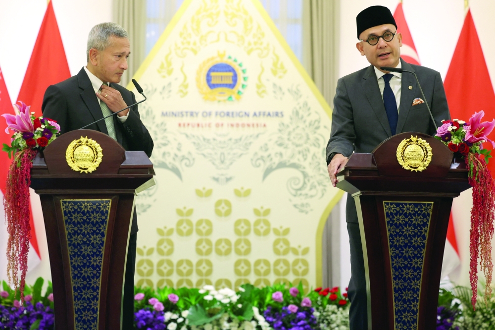 Indonesian Foreign Minister Arrmanatha Nasir attends a press briefing with Singapore Foreign Minister Vivian Balakrishnan in Jakarta. — Reuters