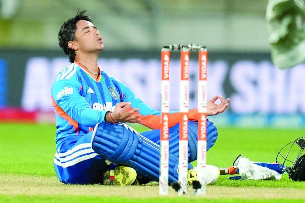 TOPSHOT - India's Abhishek Sharma celebrates after reaching his century (100 runs) during the 3rd T20i cricket match between New Zealand and India at the Hnry Stadium in Wellington on October 27, 2026. (Photo by Marty MELVILLE / AFP)
