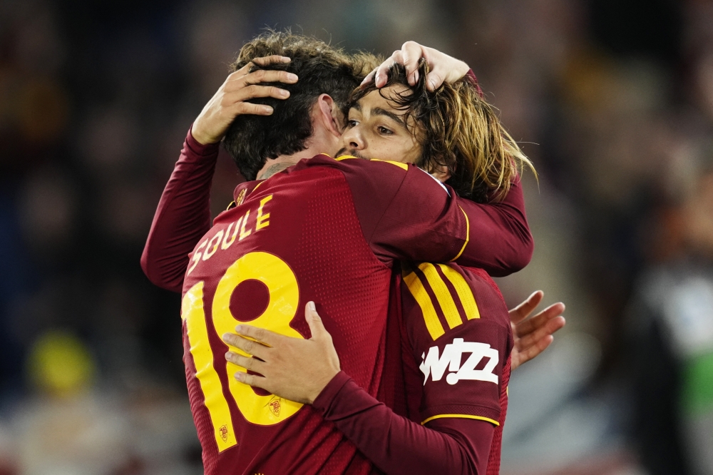  
AS Roma's Rodrigo Mora celebrates scoring their third goal with Matias Soule  