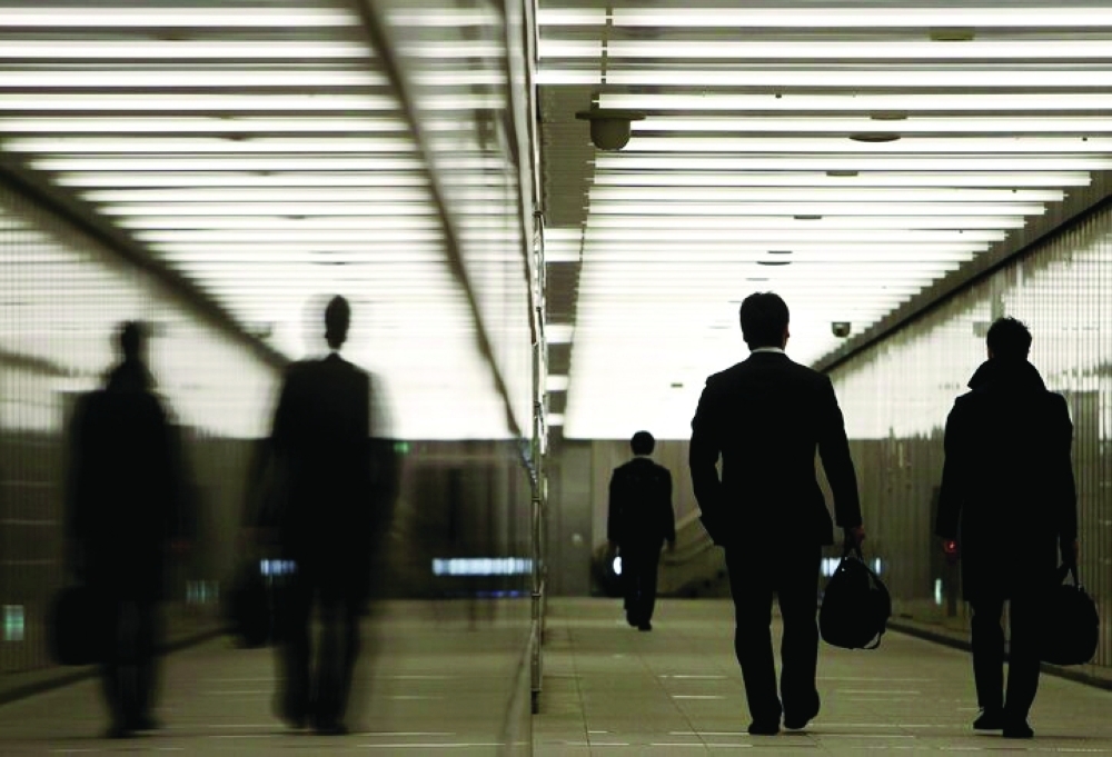 Businessmen walk through a business complex