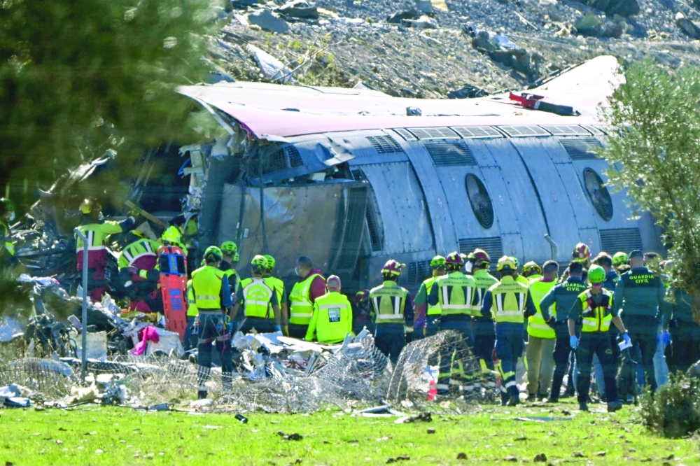 Emergency services work at the site of a train crash between Urda and Los Yebenes in the province of Toledo. — AFP