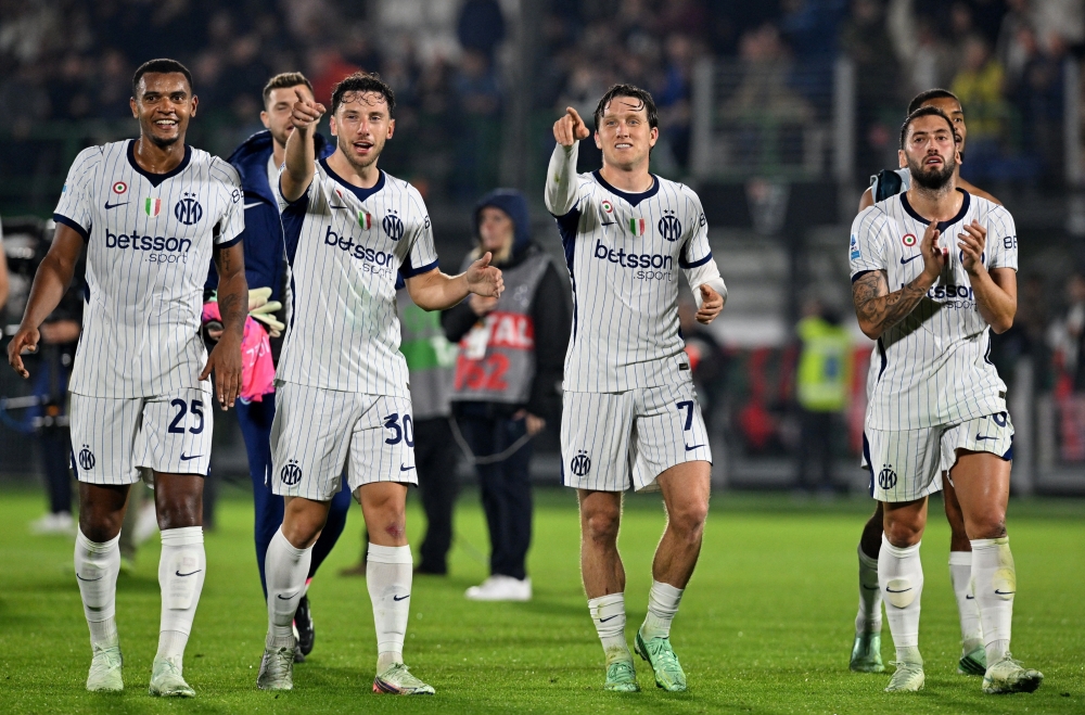  
Inter Milan's Manuel Akanji, Carlos Augusto, Piotr Zielinski and Hakan Calhanoglu  