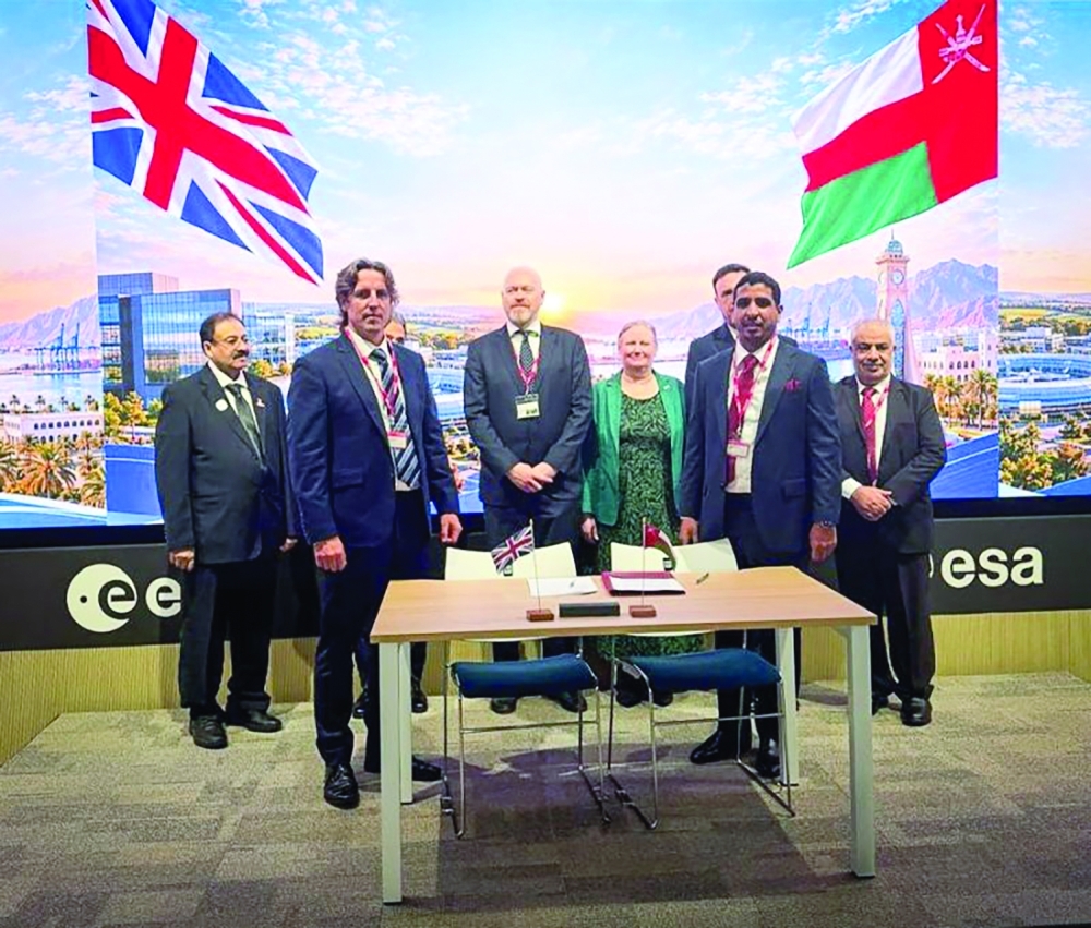 Executives representing the two partners, joined by dignitaries at the MoU signing


