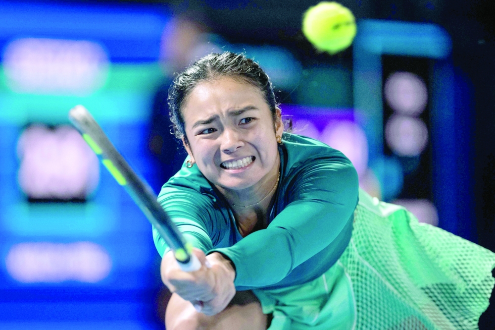 Philippines' Alexandra Eala hits a return against Russia's Diana Shnaider at Ariake Coliseum in Tokyo. 