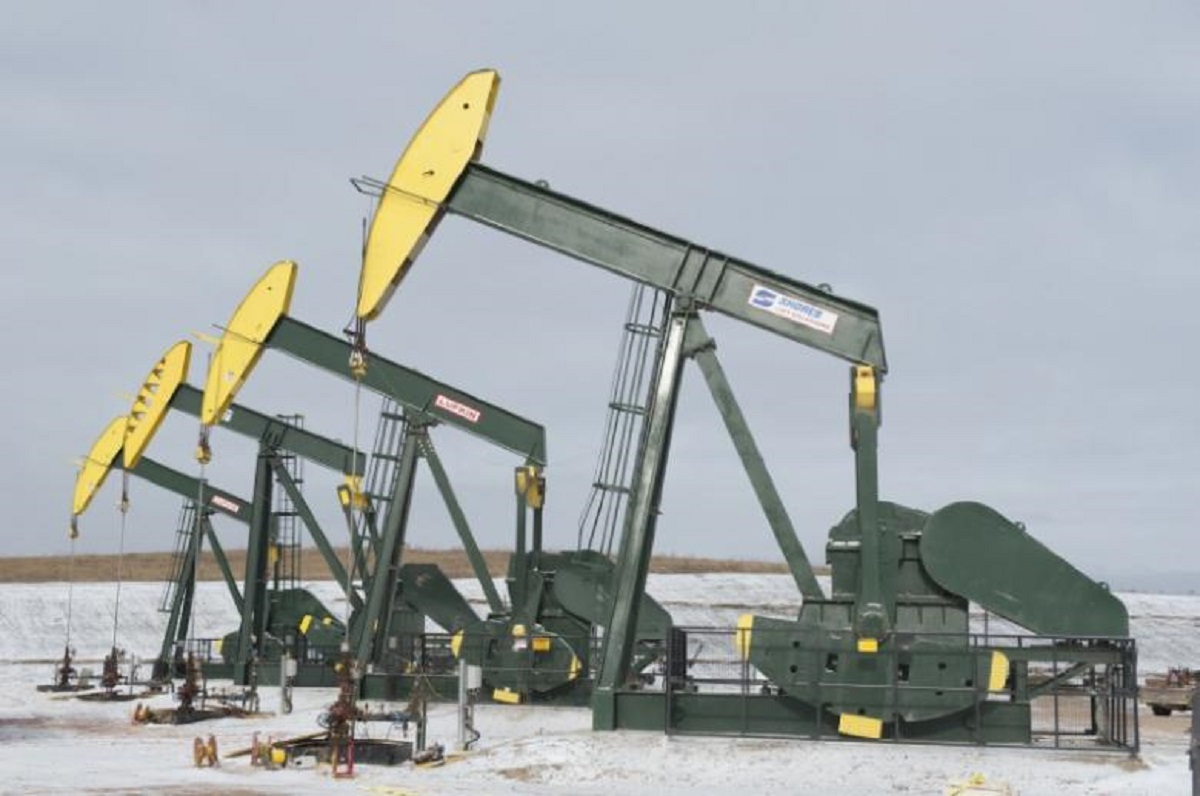 Pumpjacks taken out of production temporarily stand idle at a Hess site while new wells are fracked near Williston