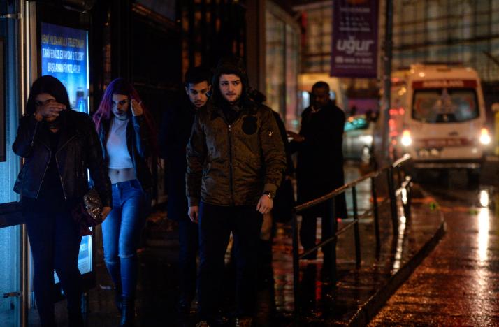 People flee from a nightclub where a gun attack took place during a New Year party in Istanbul