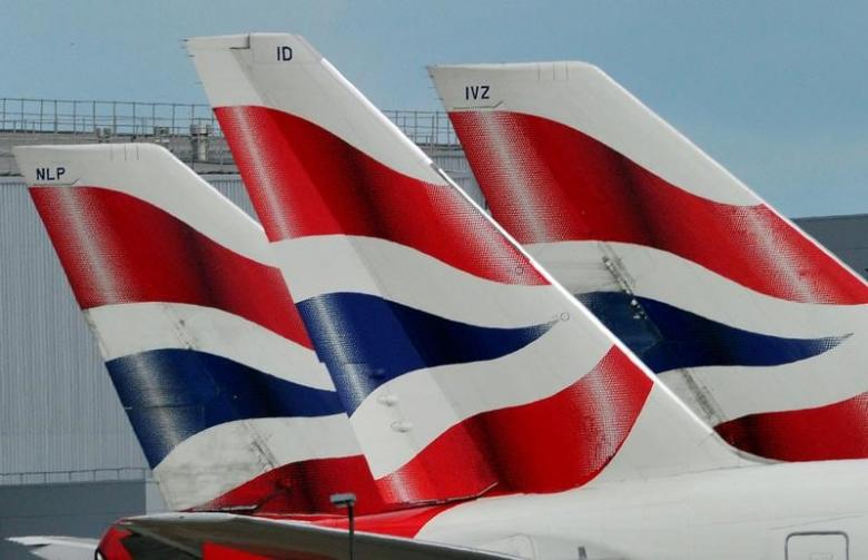 British Airways logos are seen on tailfins at Heathrow Airport in west London
