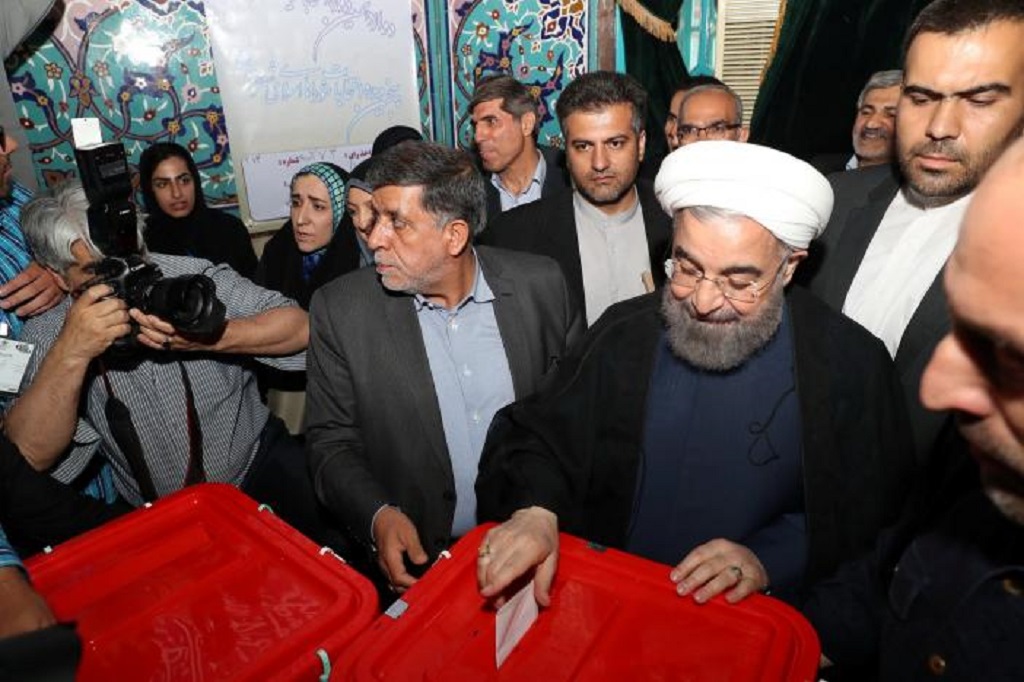 Iran's President Hassan Rouhani casts his ballot during the presidential election in Tehran