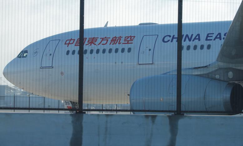 A China Eastern Airlines Airbus A330 aircraft sits on the tarmac at Sydney International Airport in Australia