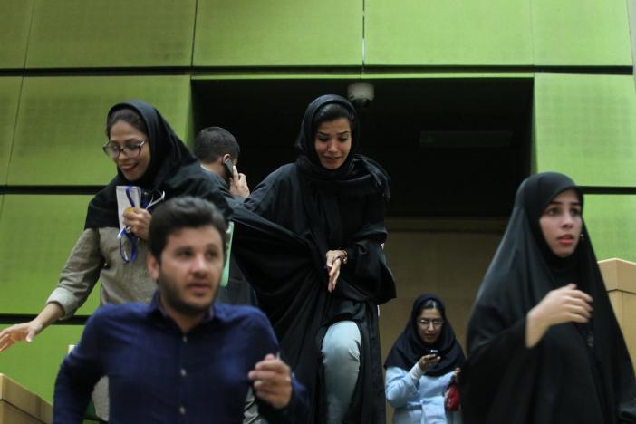 Women are seen inside the parliament during an attack in central Tehran