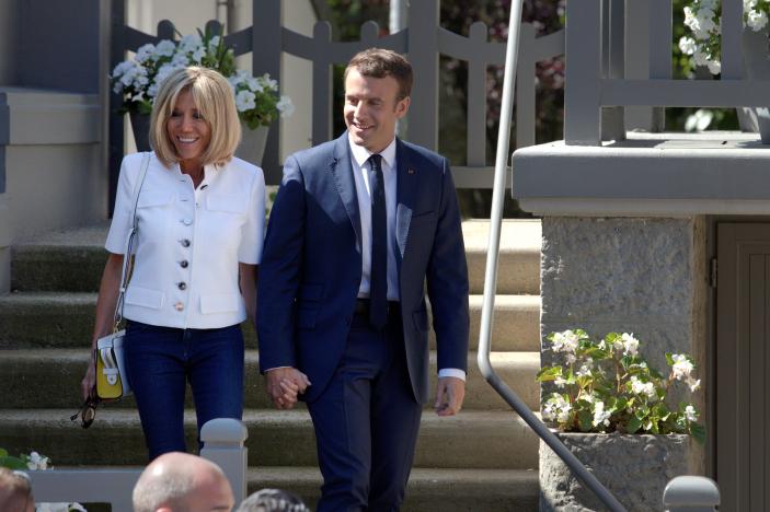 French President Emmanuel Macron and wife Brigitte leave home to vote in parliamentary elections in Le Touquet