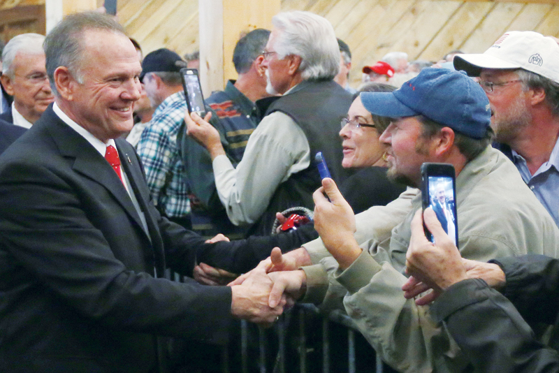 Voters head to polls in Alabama race with high stakes for Trump Oman