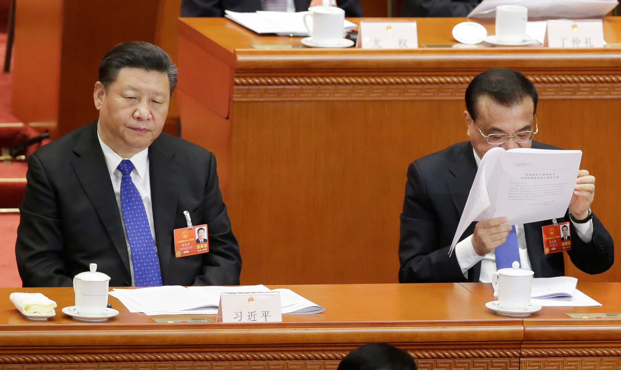 Chinese President Xi Jinping and Premier Li Keqiang attend the fourth plenary session of the NPC in Beijing