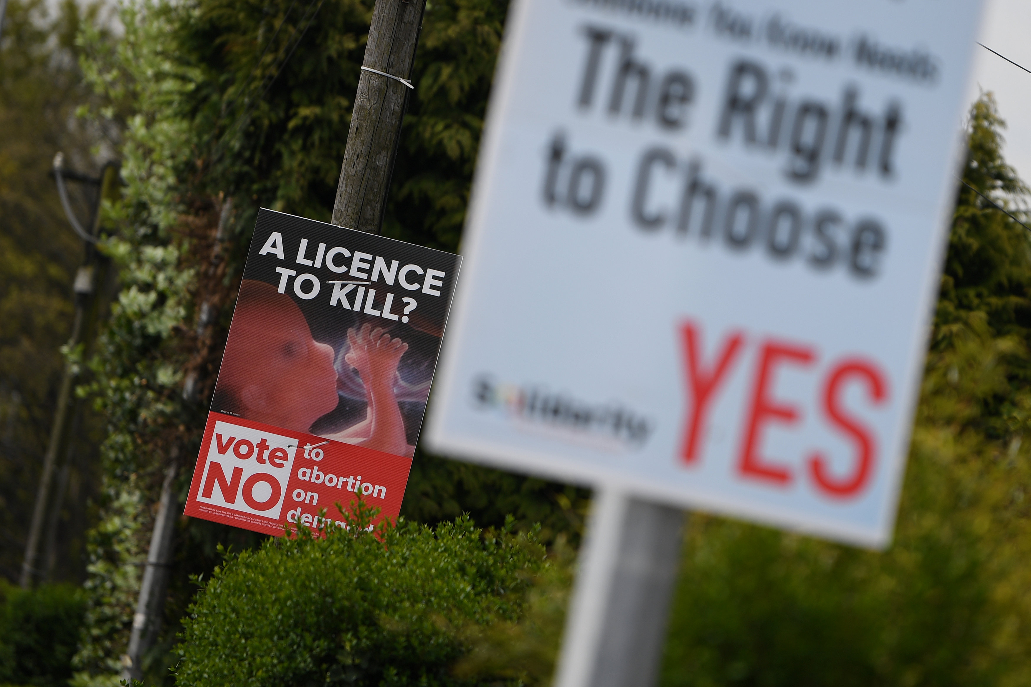 Pro-Life and Pro-Choice posters are seen outside the home of Amy Callahan who received a fatal foetal diagnosis at 12 weeks into her pregnancy and travelled to Liverpool for a termination in Dublin