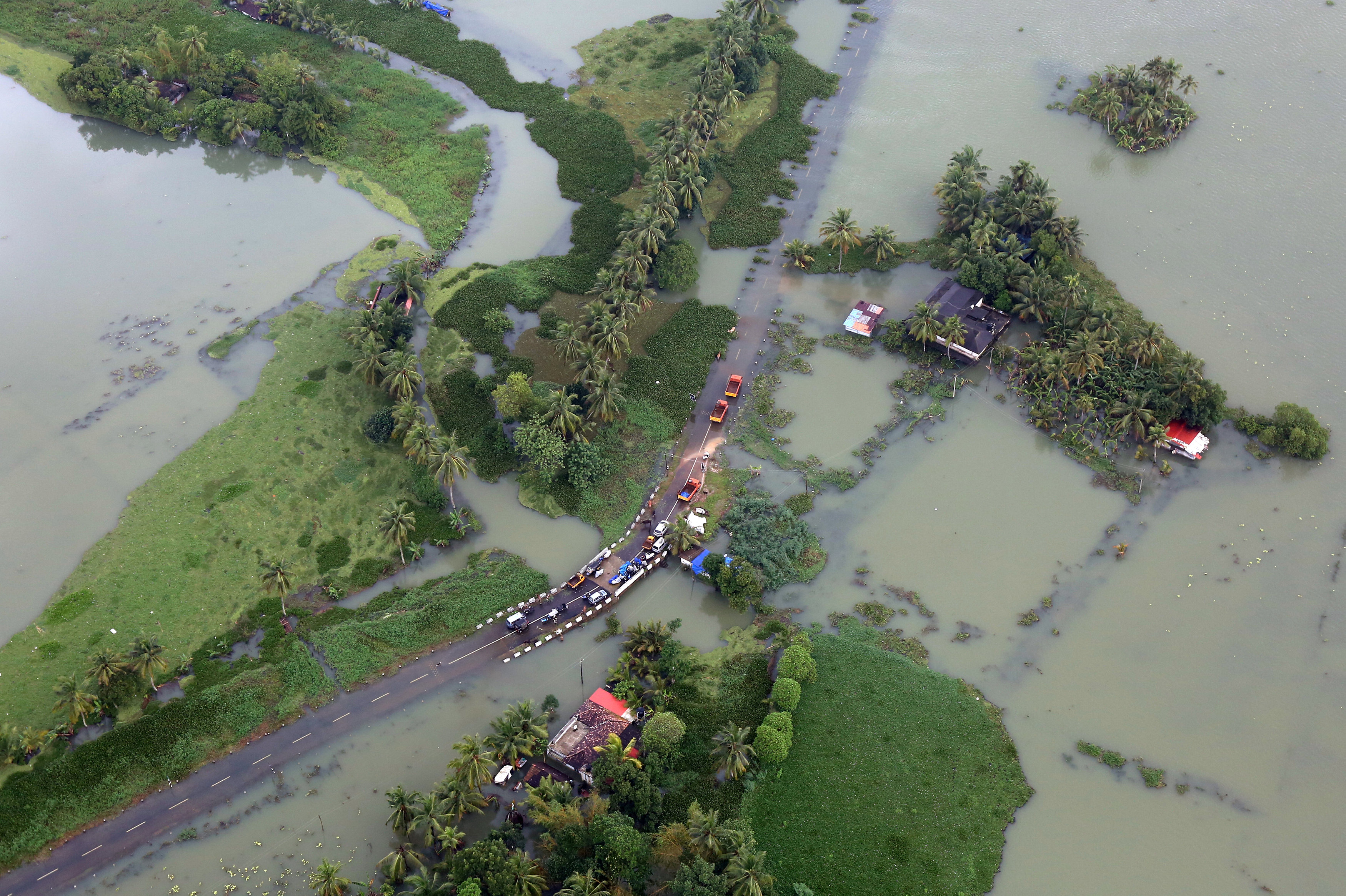 An aerial view shows partially submerged road at a flooded area in the southern state of Kerala