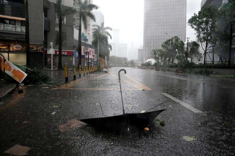 An umbrella is seen on a road after a rainstorm as Typhoon Mangkhut makes landfall in Guangdong province in Shenzhen