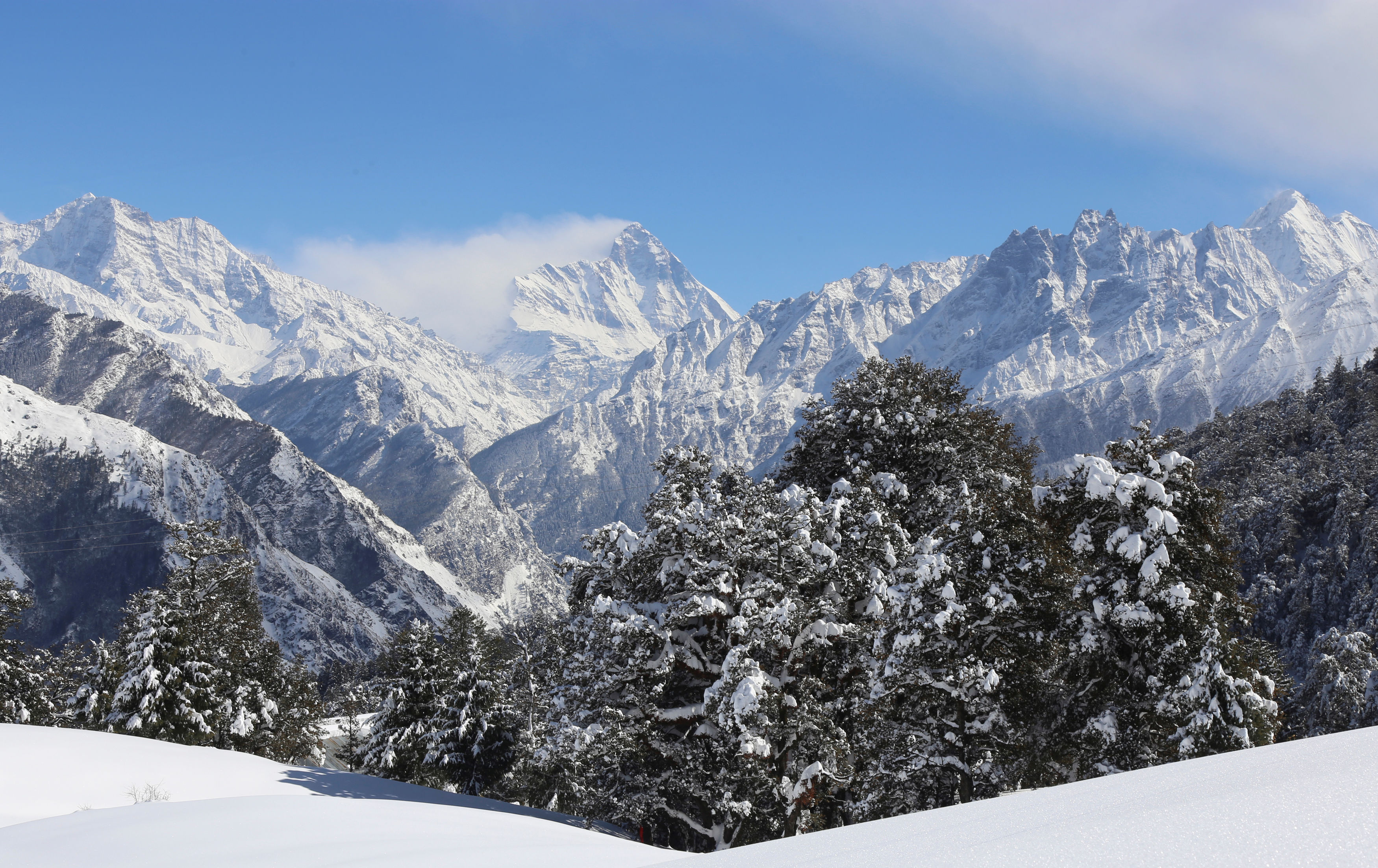 Snow-covered Nanda Devi mountain is seen from Auli town