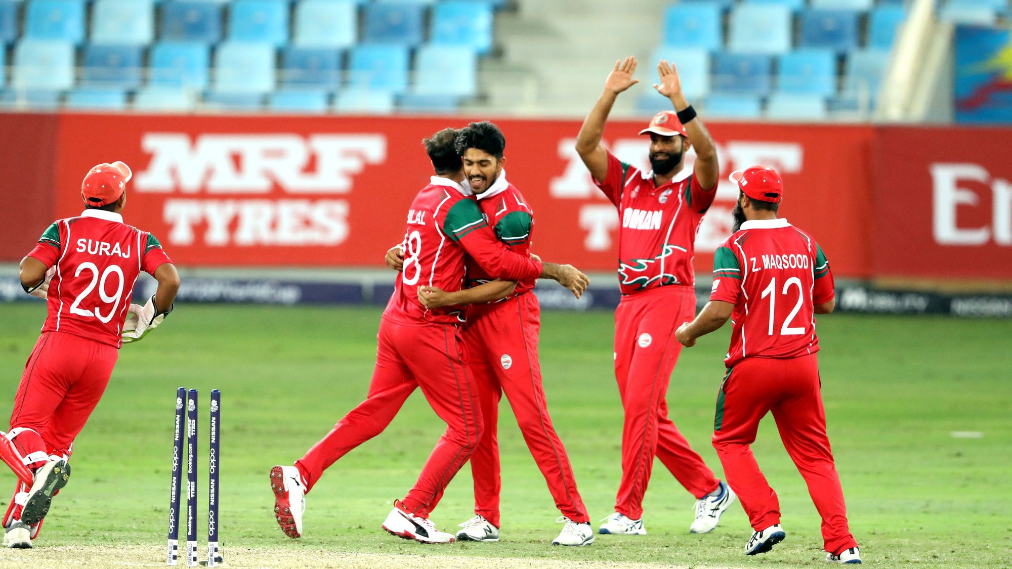 Oman-celebrate-wicket-of-Nizakat-Khan