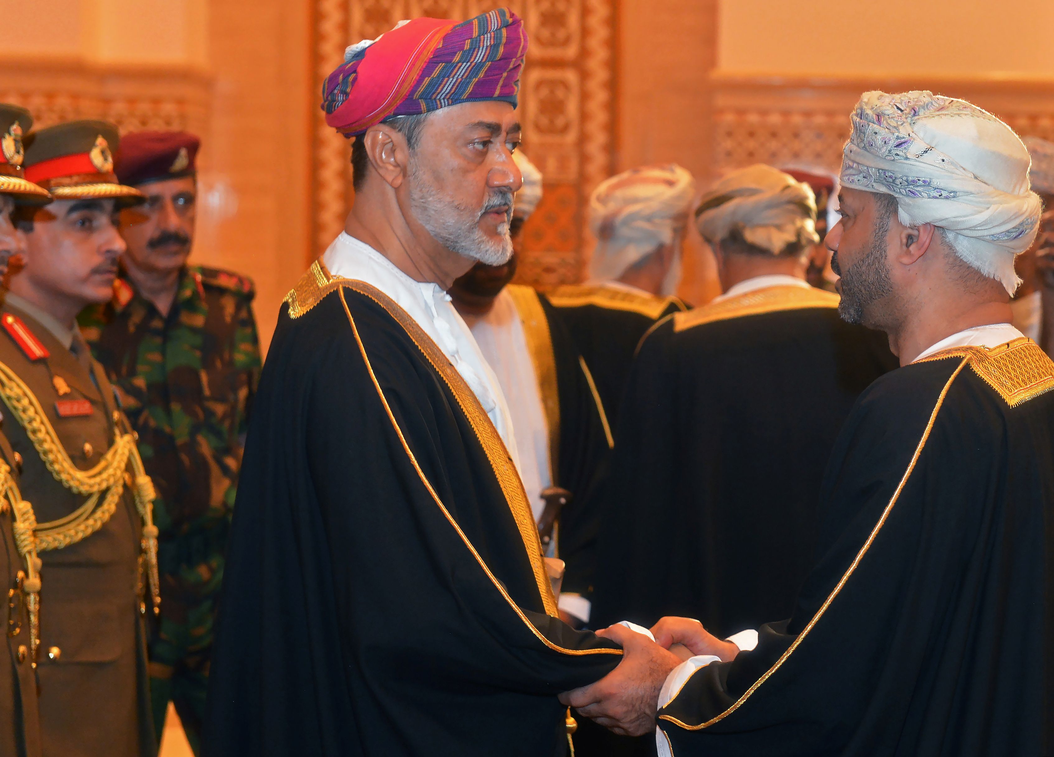 Oman's newly sworn-in Sultan Haitham bin Tariq al-Said receives condolences during the funeral of his cousin, the late Sultan Qaboos in Muscat
