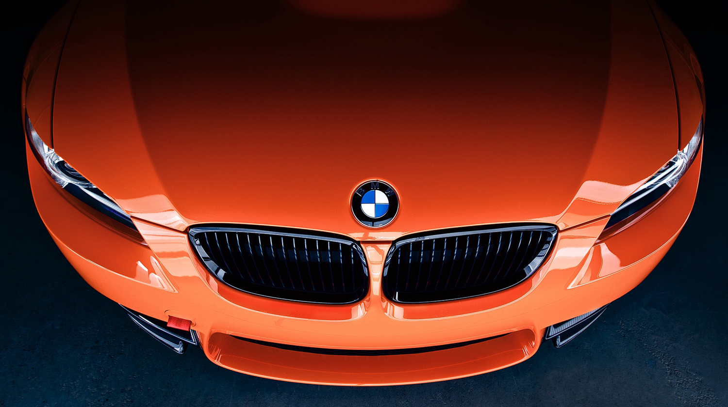 Logo-Close-Up-and-Front-BMW-M3-Orange