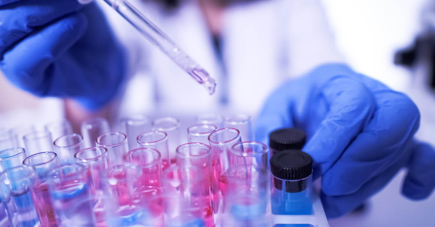 female lab technician doing research with a microscope in the lab. coronavirus