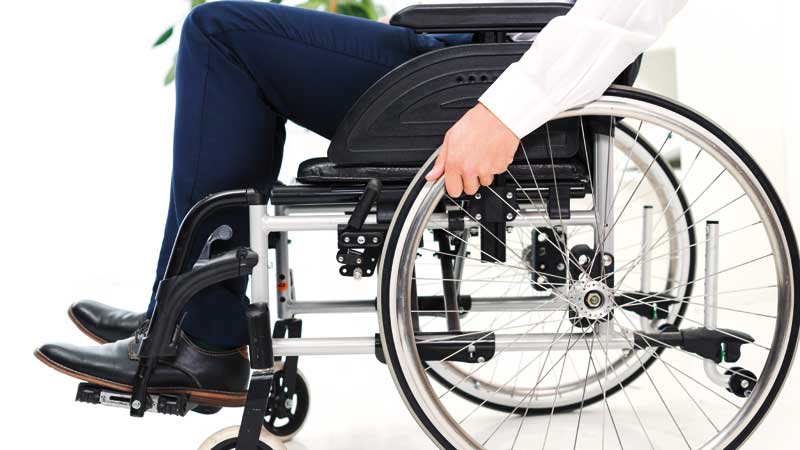 businessman-s-hand-wheel-sitting-wheelchair